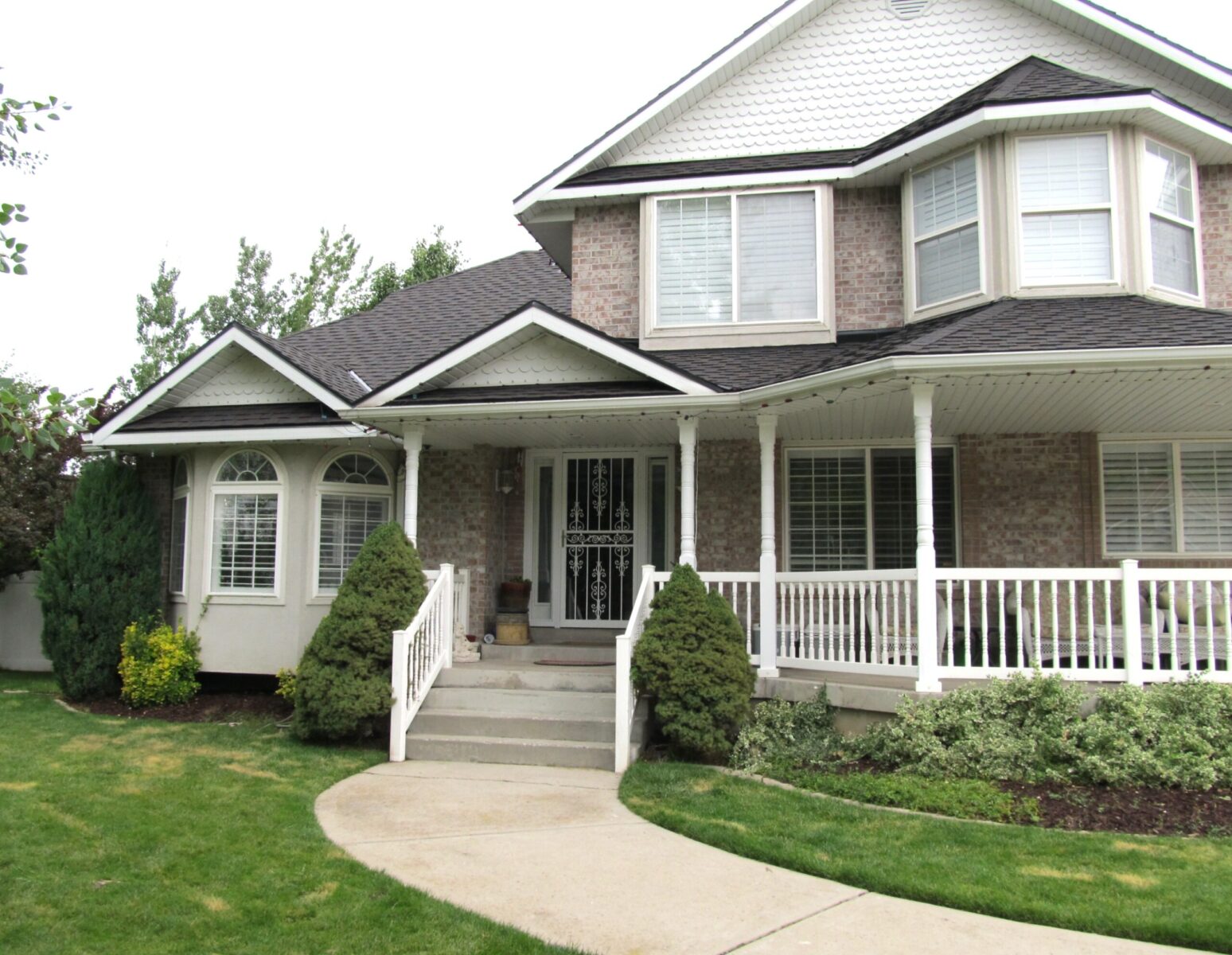 Front of a two story residential house with roof installed