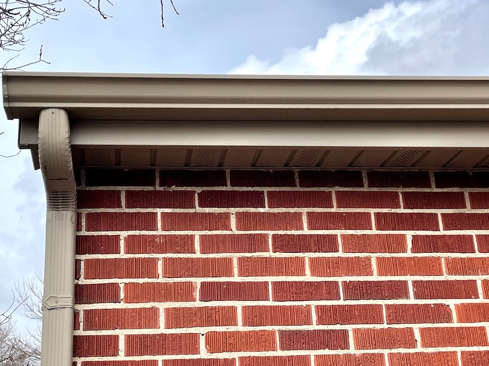 Down spout installation on brick in Murray, Utah