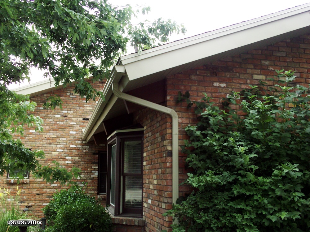gutter installation with corner down spout